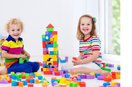 Child playing with building blocks to beat boredom