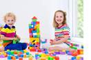 Child playing with building blocks to beat boredom